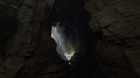 light streams through an ancient cave formation revealing hidden beauty
