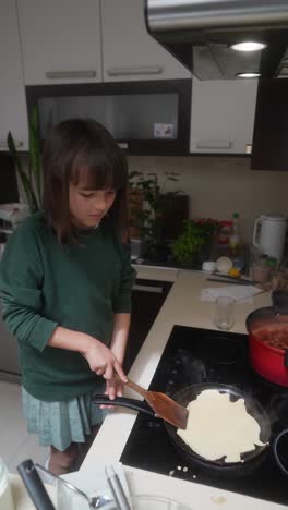 girl cooking pancakes