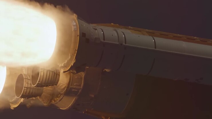 Close up view of a rocket engine during launch showing intense fire and smoke exhaust
