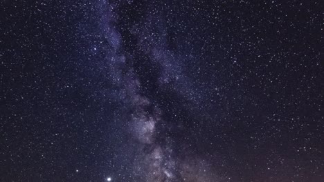 a time-lapse video of the sky in night with stars