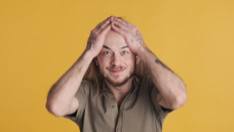 caucasian young man surprised in front of the camera.