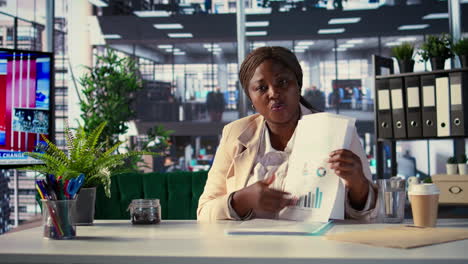 businesswoman reviewing documents in office