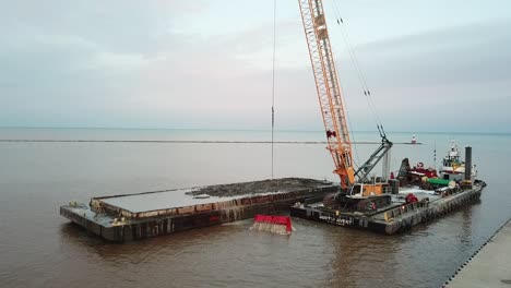 Dredging-operation-in-Kewaunee-Harbor-on-Lake-Michigan,-Kewaunee,-Wisconsin