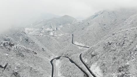 Snowy-mountains-and-road-with-drones-Seoraksan,-South-Korea