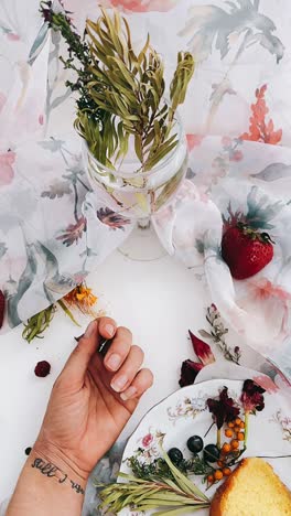 elegant still life with flowers, fruit and cake