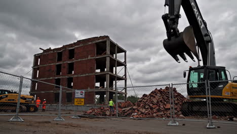 demolition of a building with excavator