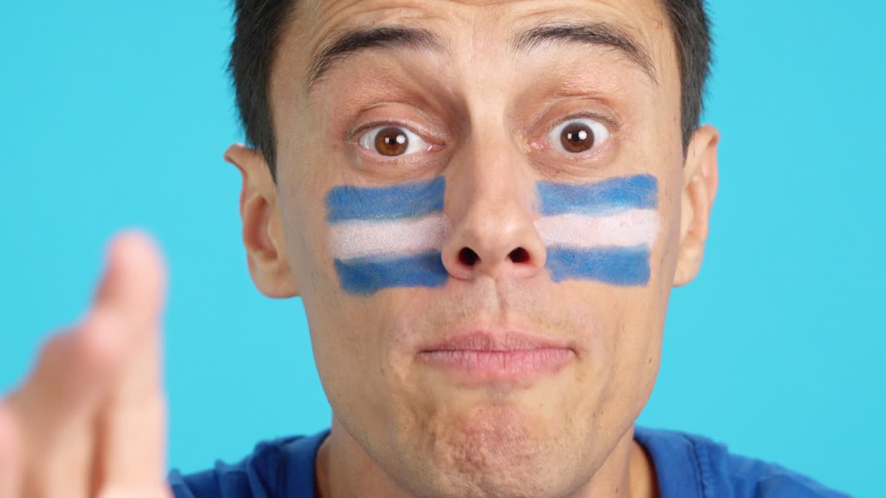 Close up of a man supporting salvadoran team