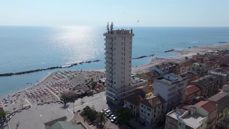 lively birds join us on our aerial journey to the coast of porto recanati, piazza brancondi, italy