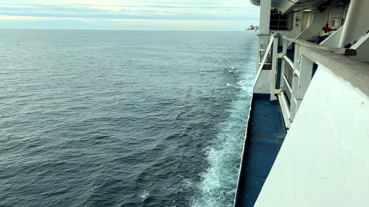 ship traveling through water giving a white wake