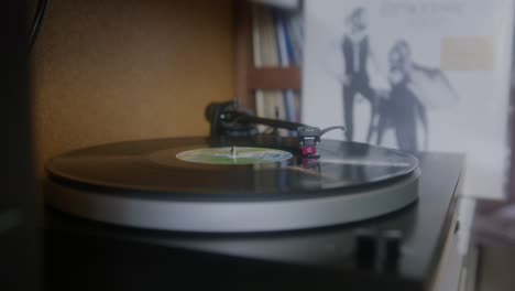 The-ending-of-the-vinyl-record-on-the-big-wooden-desk