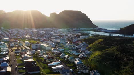 sunset over city of heimaey in westman islands in south iceland