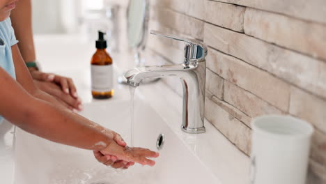 Woman,-help-and-child-washing-hands-in-bathroom