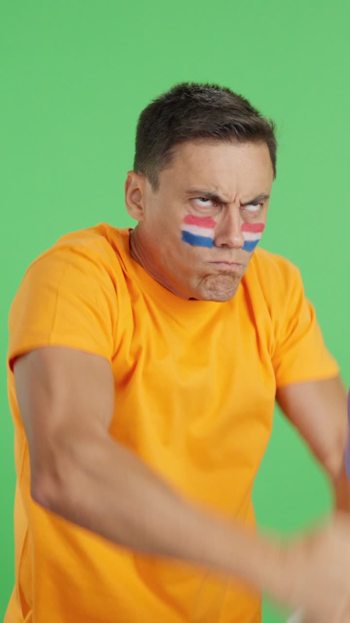 Man cheering for Holland, angry with the decision of referee