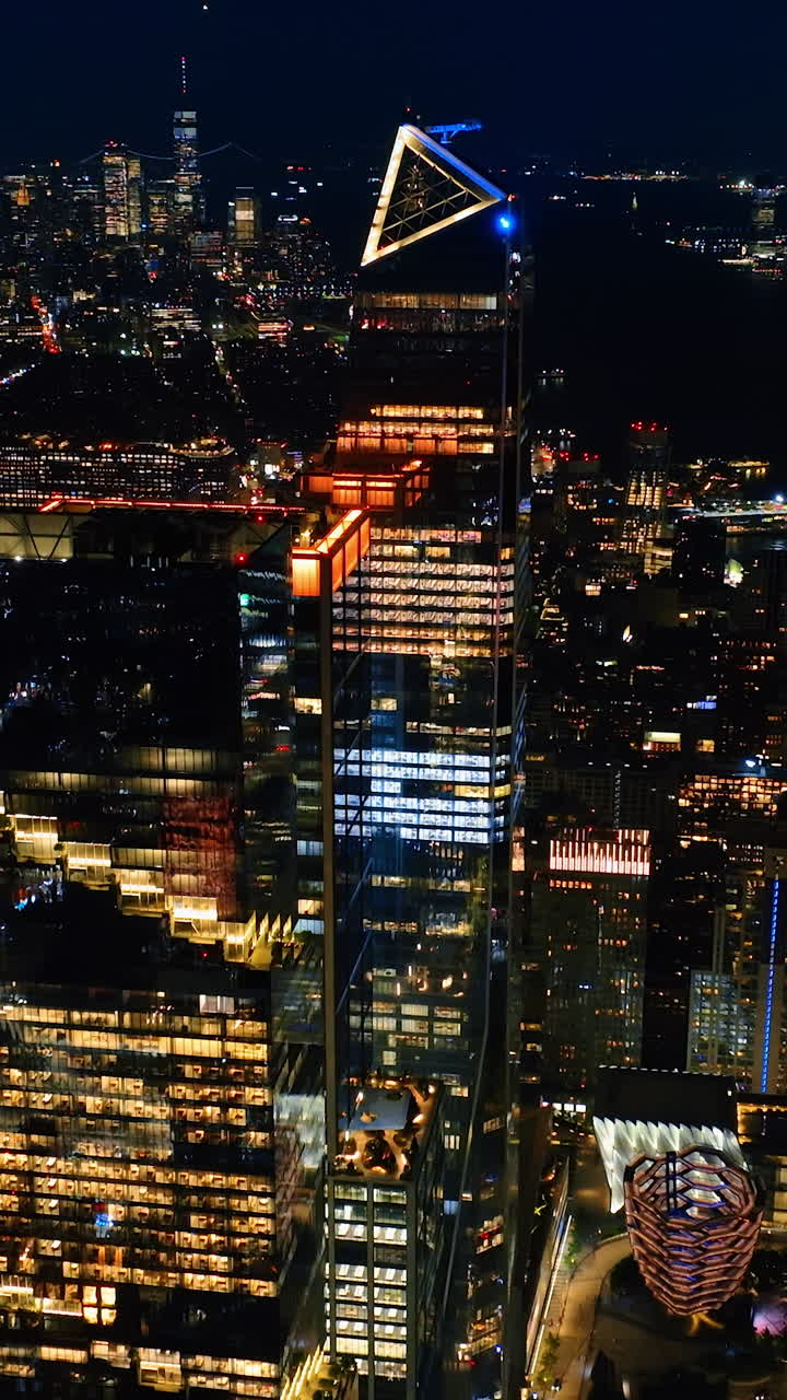 Luminous sparkling New York at night. Breath-taking scenery of the lively city from top. Vertical video