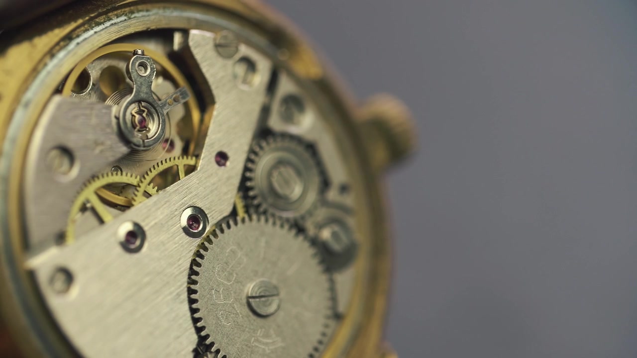 Macro Shot of a Vintage Watch Mechanism with Moving Gears