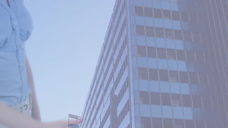 standing near modern skyscraper, businessman with cityscape animation in background