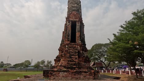 tourists exploring historical brick temple ruins