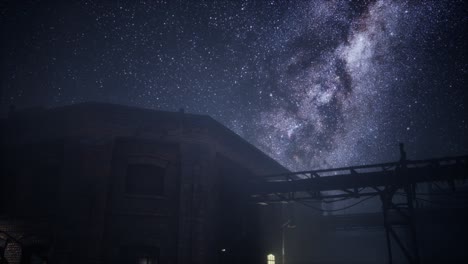 milky way stars above abandoned old fatory