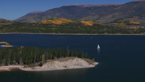 sailboats little wind islands lake dillon marina colorado fall colors aerial cinematic drone morning view frisco breckenridge silverthorne ten mile range calm reflective water circle right motion