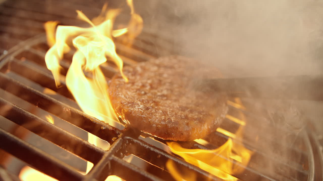 Burger being cooked on a grill