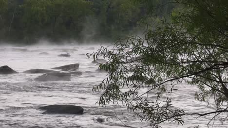 dramatic mist hovers over the james river in the morning