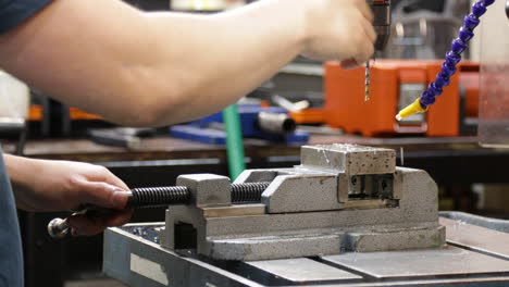 Drilling-Metal-Block-On-Drill-Press,-Closeup-Shot