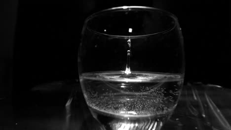 drop falling into a glass