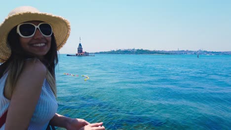 beautiful girl takes pictures of bosphorus,a popular destination in uskudar town,istanbul,turkey
