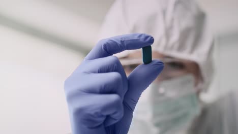 video of capsule in hands of a laboratory technician