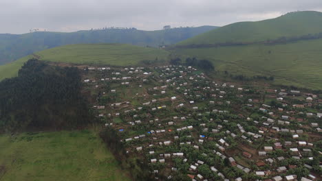 aerial: picturesque congo town of mushaki built into green hillside