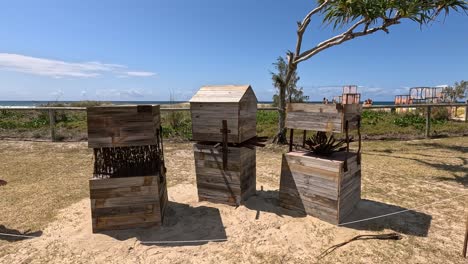 wooden art installation at currumbin beach