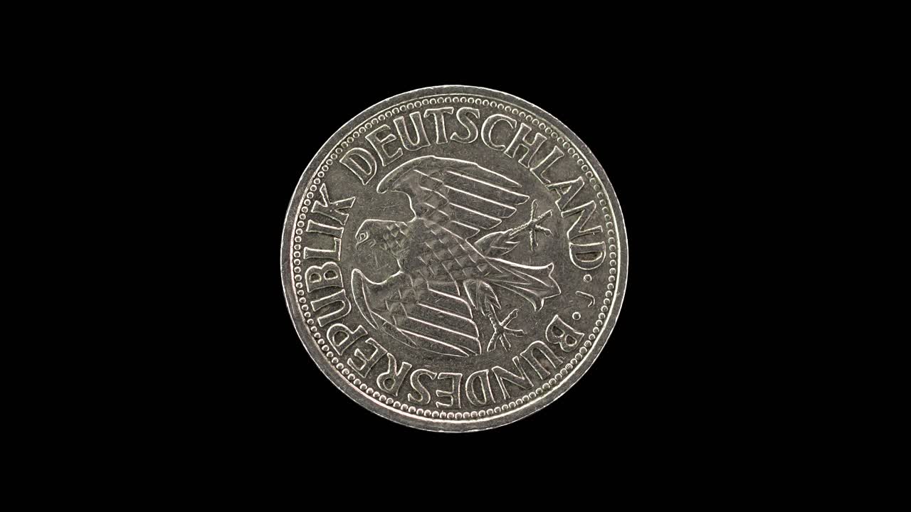 Germany 1 Deutsche Mark 1958 obverse with federal eagle emblem, macro loop on black background
