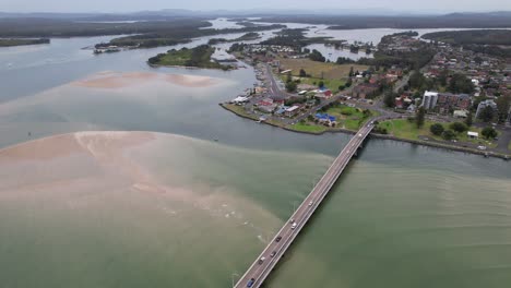 Town Of Tuncurry On The Banks Of Coolongolook River In New South Wales, Australia. aerial sideways shot