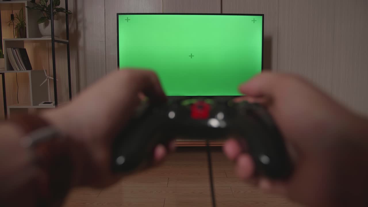Hands Gamer Using Joystick Play A Game With Green Screen Tv At Home