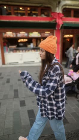 young woman walking on a city street