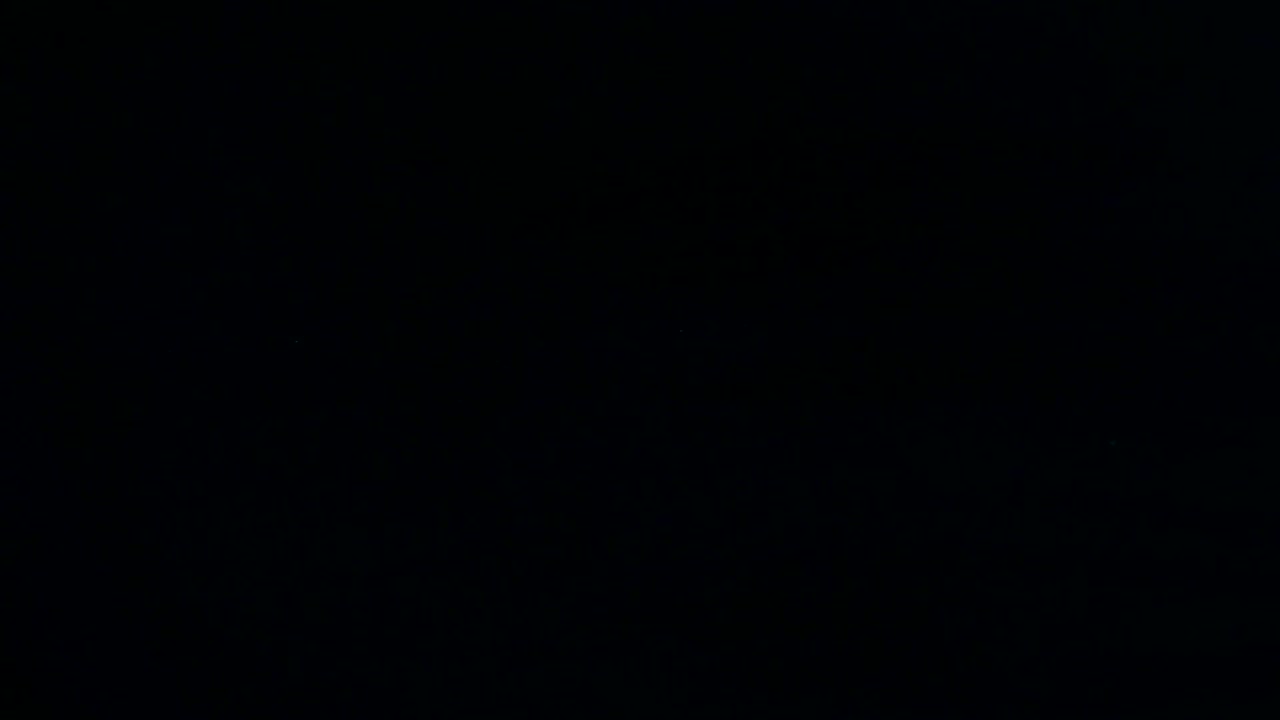 Bitcoin coins with letter falling on black surface