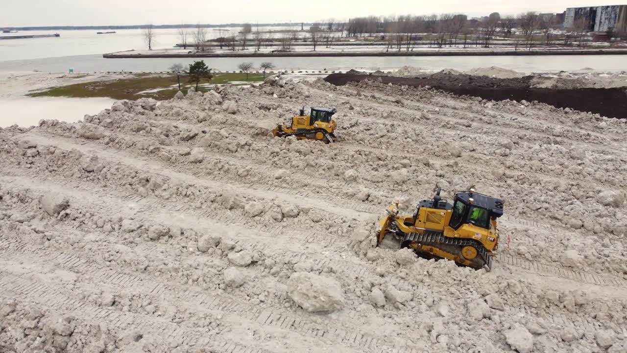 Bulldozers At Work On Snow Dump, Trying To Reduce Large Pile Of Hauled Snow Caused By Extreme Snowstorm In Buffalo, New York, USA