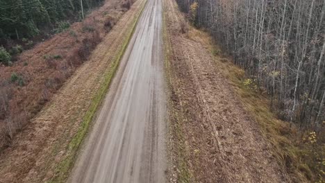 drone flying over a wet country road in the autumn