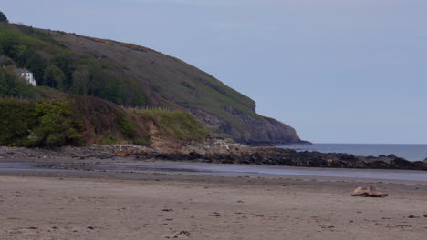 Shots of the headland and beach at low tide at Poppit Sands Beach, Teifi Estuary,