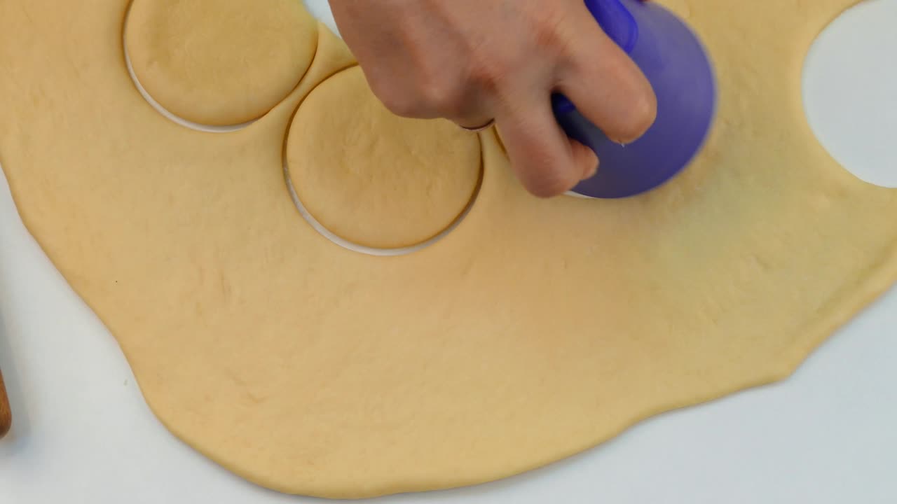 The cook makes the blanks from the dough