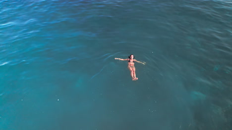 Isolated-woman-swimming-in-the-sea