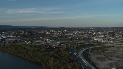 Wide-aerial-footage-of-downtown-Chattanooga-with-highway-27-and-merging-into-highway-24-during-the-sunset