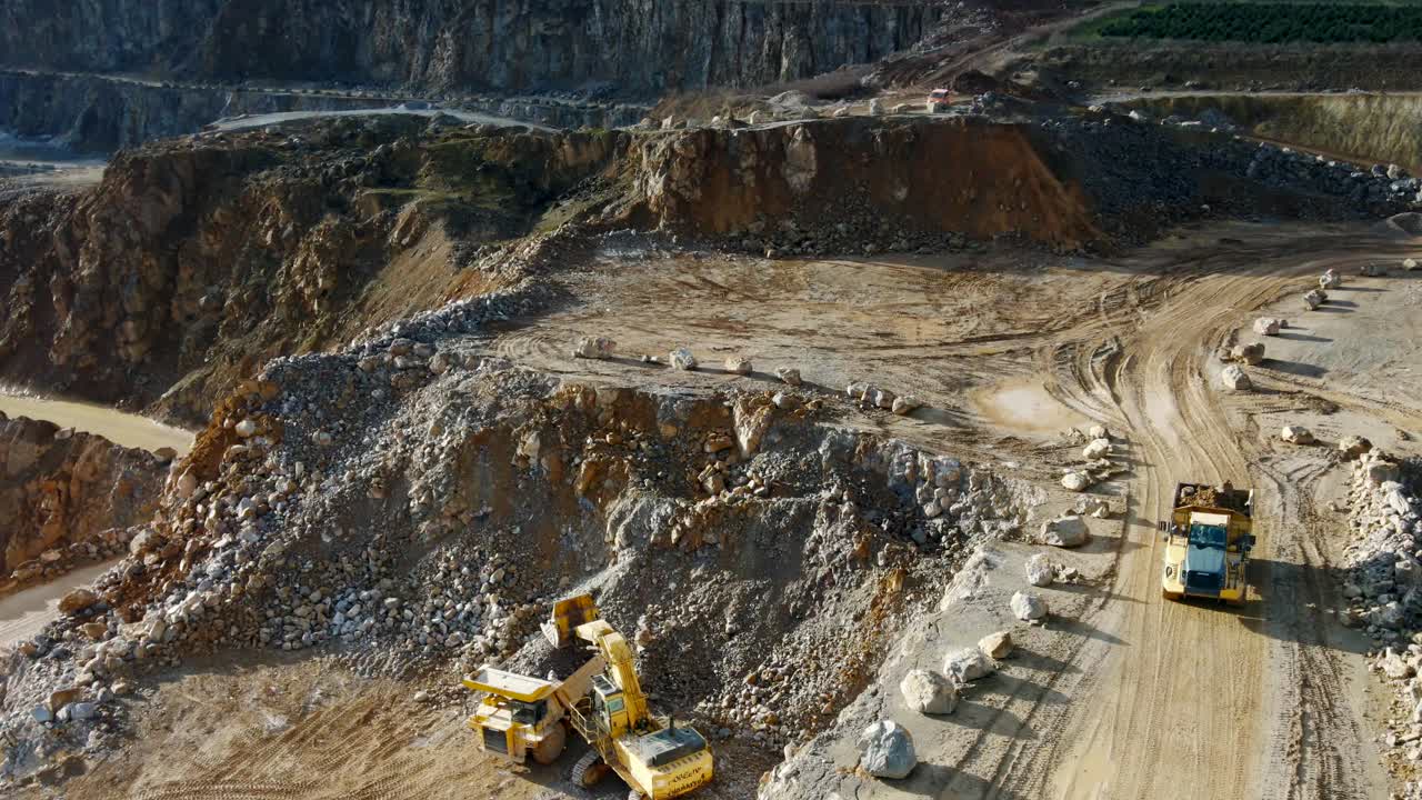 Unearthing the Earth's Resources: An Aerial View of Heavy Machinery in Action at a Limestone Quarry in Germany