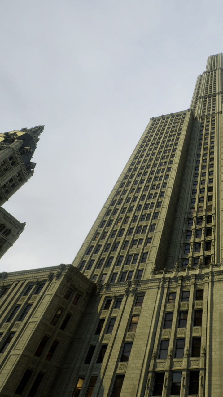 Majestic skyscrapers rise under a cloudy sky in the heart of the city