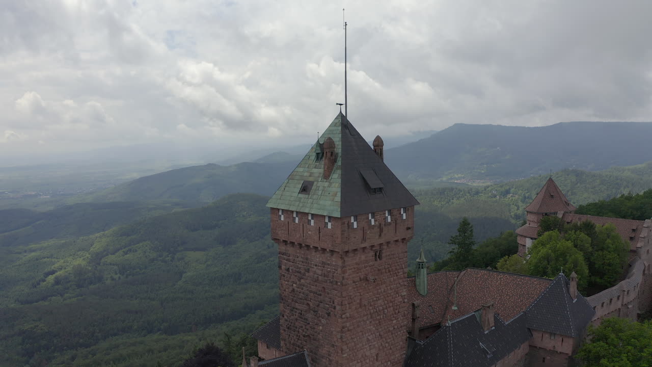 Circulating aerial shot of a tower of a renovated medieval castle in the Alsace region of France
