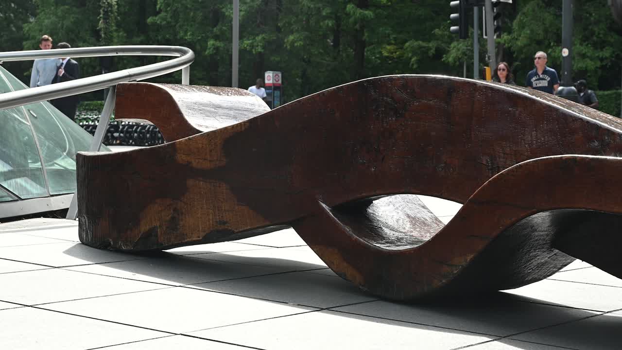 Modern Wooden Sculpture Bench in Urban Park