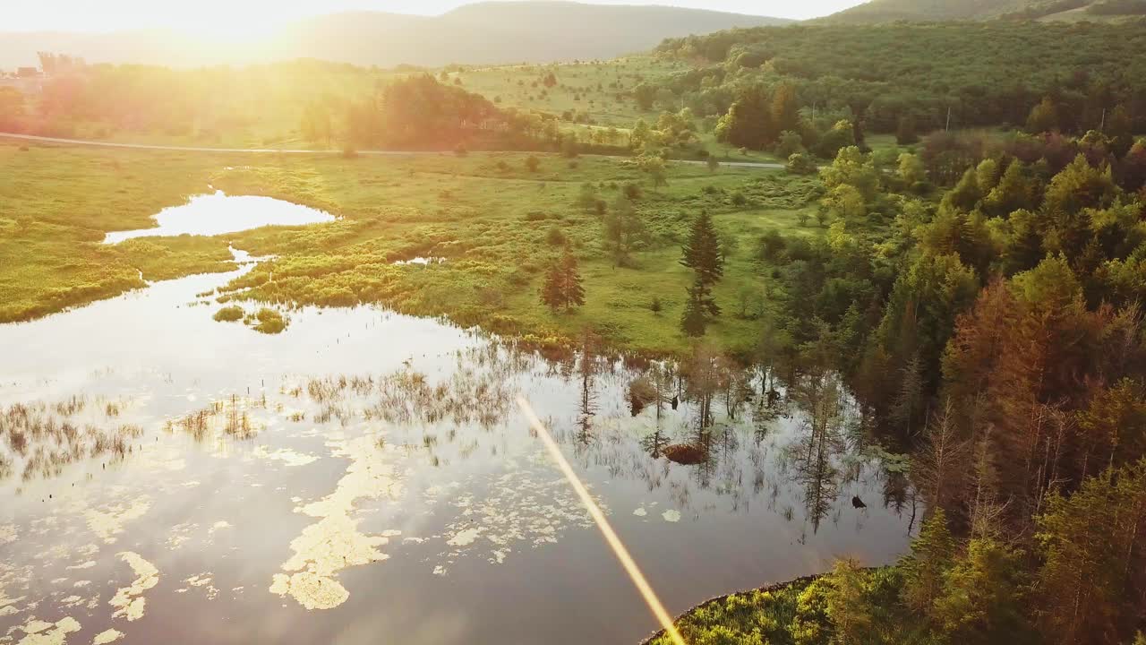 Backlit Ponds With Morning Sunrise Sunlight And Clouds Reflecting Epic Cinematic 4K