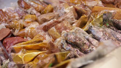 variety of packaged meats in a grocery store
