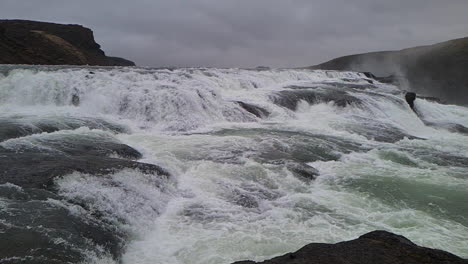 powerful river rapids and cascades above gullfoss waterfall, iceland