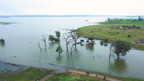 aerial drone shot of a flood hit village sumberged in water during monsoon season in india